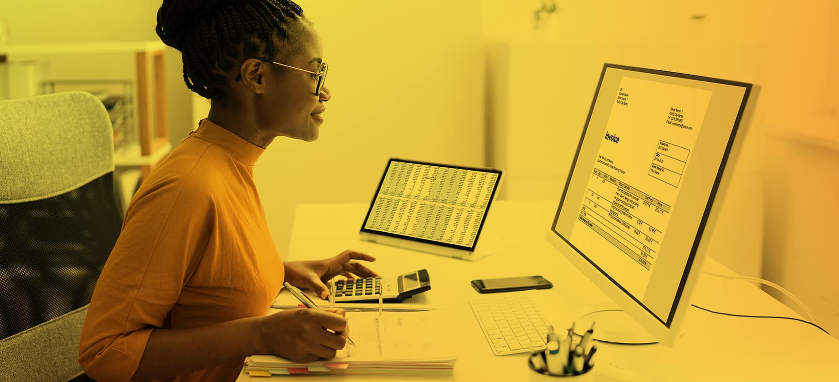 Woman works at her computer in outsourced back office support