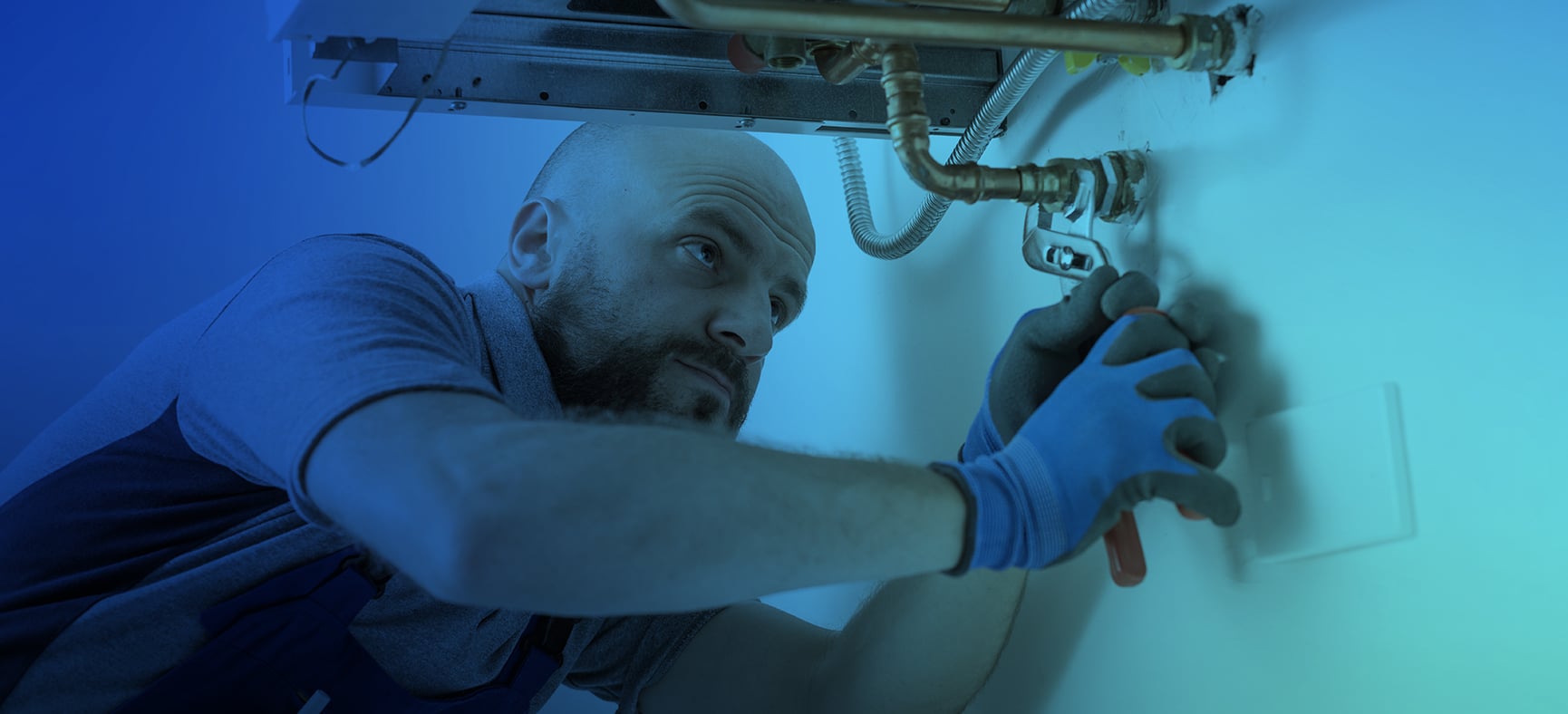 Plumber works on a natural gas boiler