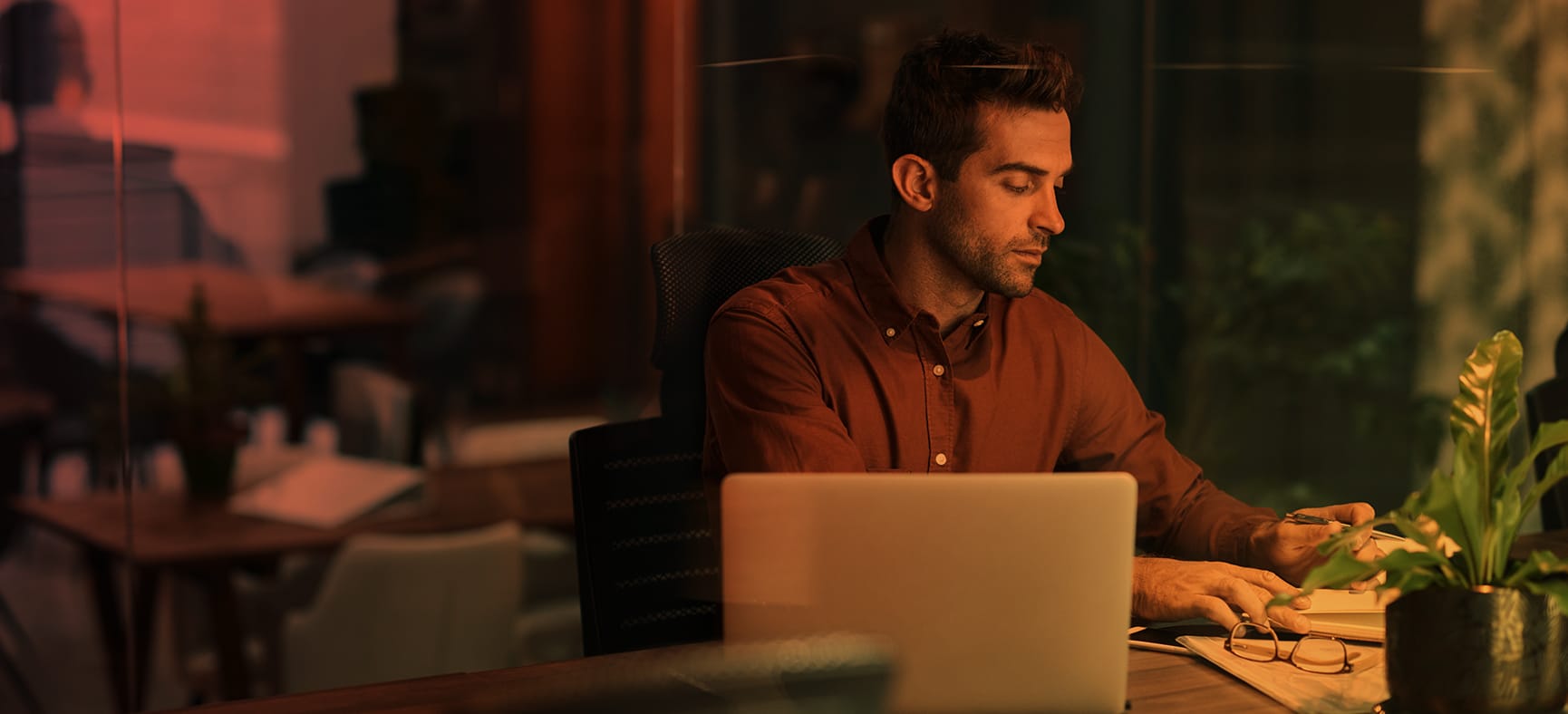 Small business owner sits at his desk and tries to understand new reporting requirements from the Corporate Transparency Act