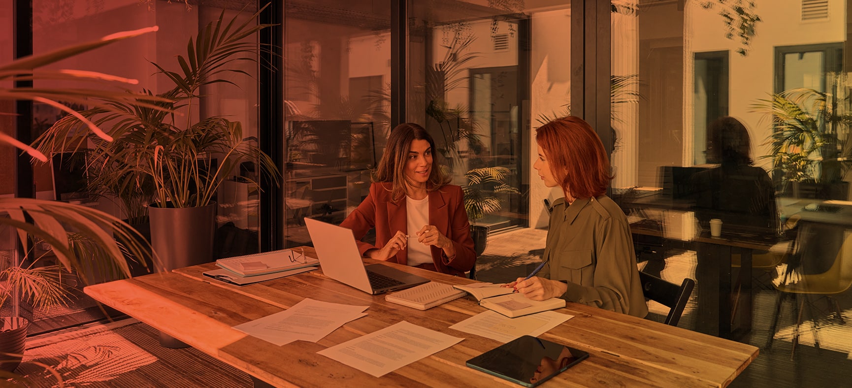 Two Business Women Discuss How to File the BOI Report